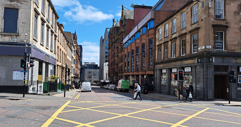 Pedestrians shown crossing the road at West Regent Street in Glasgow