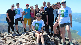 Shows a group at the summit of Ben Staray from the 2022 Munro challenge
